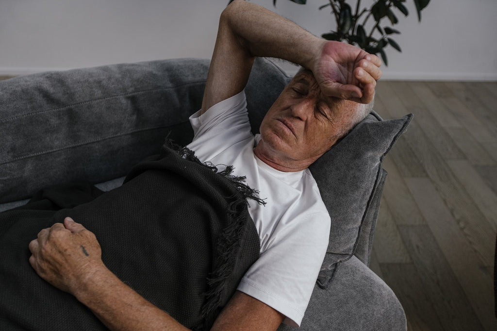 Old Man Sleeping on a Sofa